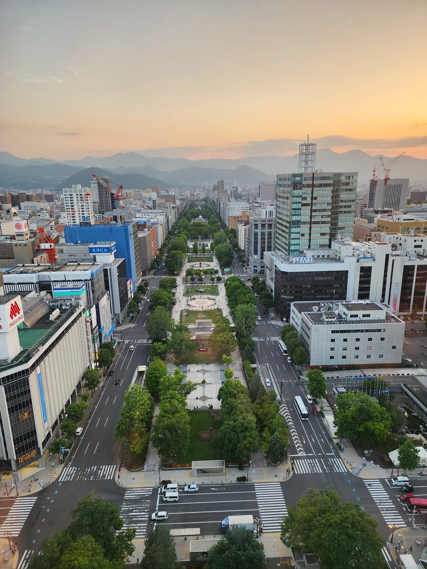 Odori Park in central Sapporo, representing the city-base side of a Sapporo versus Niseko lodging decision