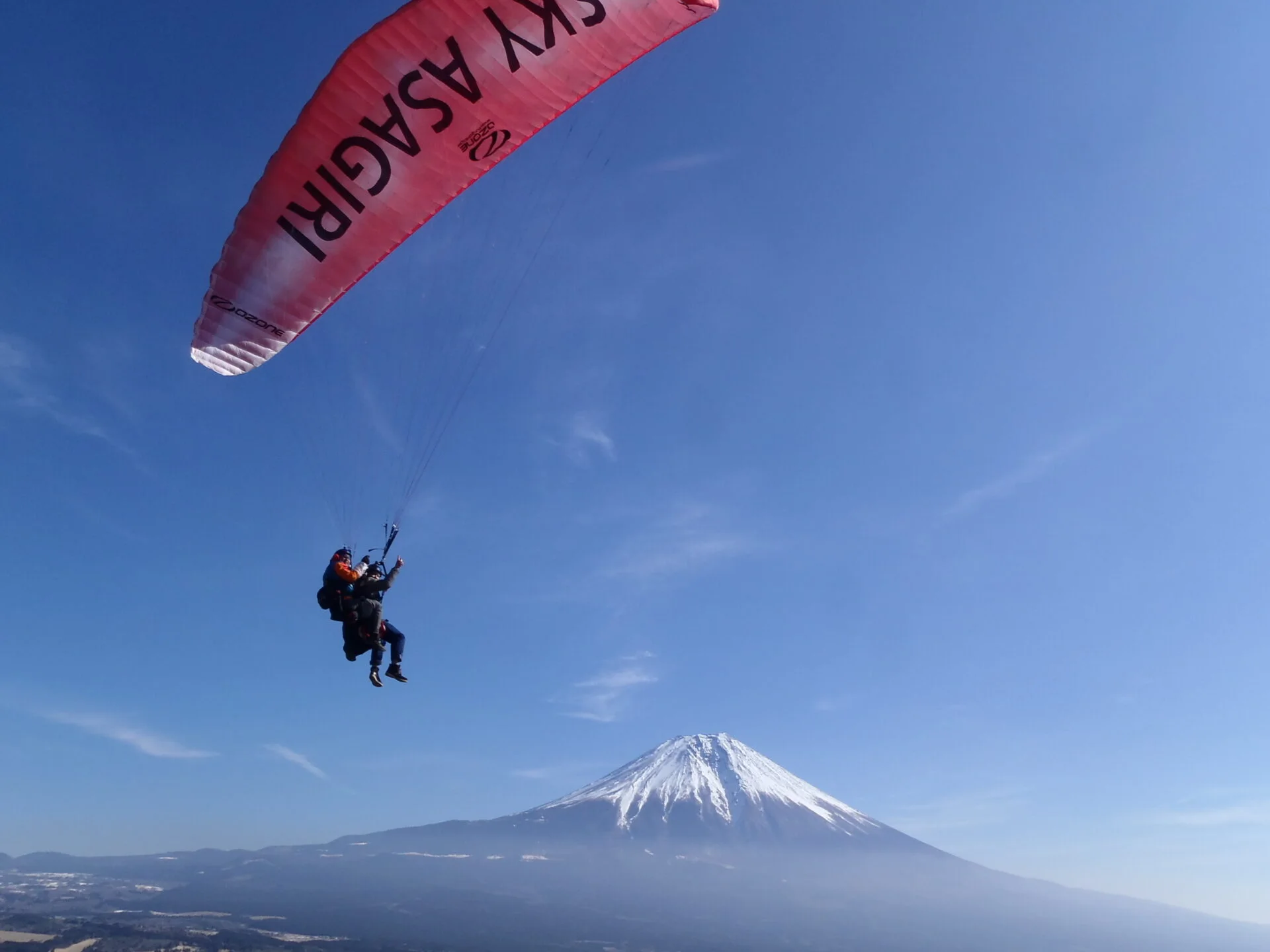 Sky Asagiri tandem paragliding over Asagiri Plateau with Mount Fuji in the distance