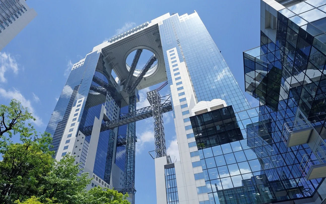 Umeda Sky Building Kuchu Teien Observatory at height, where the paid value comes from the open-air rooftop and sunset-to-night transition