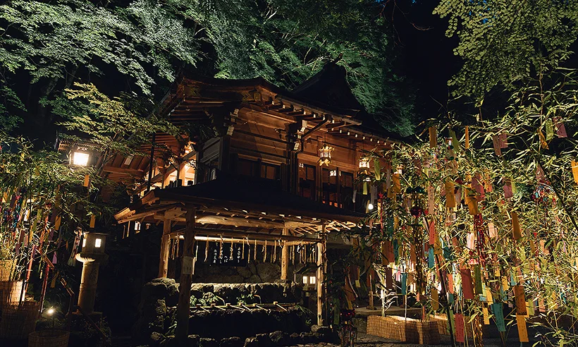 Red lantern approach at Kifune Shrine in summer greenery