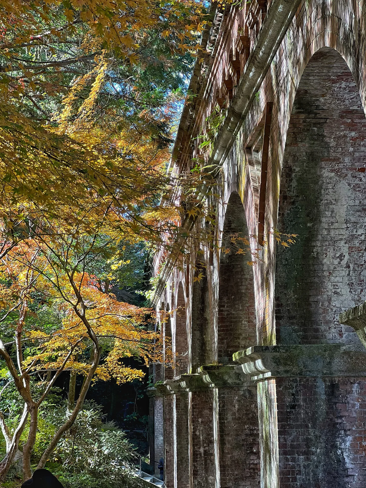 Nanzenji aqueduct in autumn, where early photography must not block the public passage