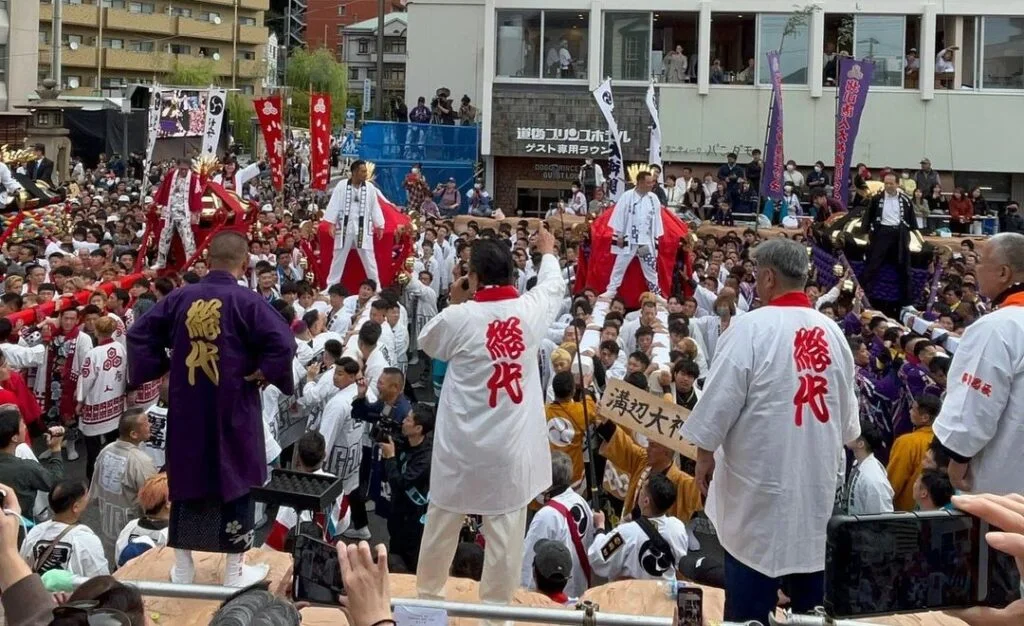 Two large mikoshi approaching each other during the Matsuyama Dogo autumn festival