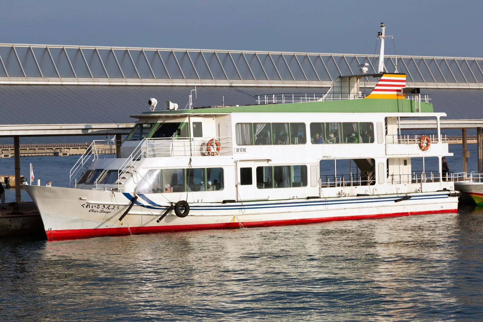 Passenger ferry at Takamatsu Port illustrating the ferry and island-bus chain for Shodoshima