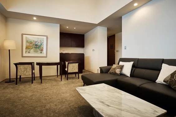 Living room and large windows in a lake-view suite at Hakone Hotel on Lake Ashi