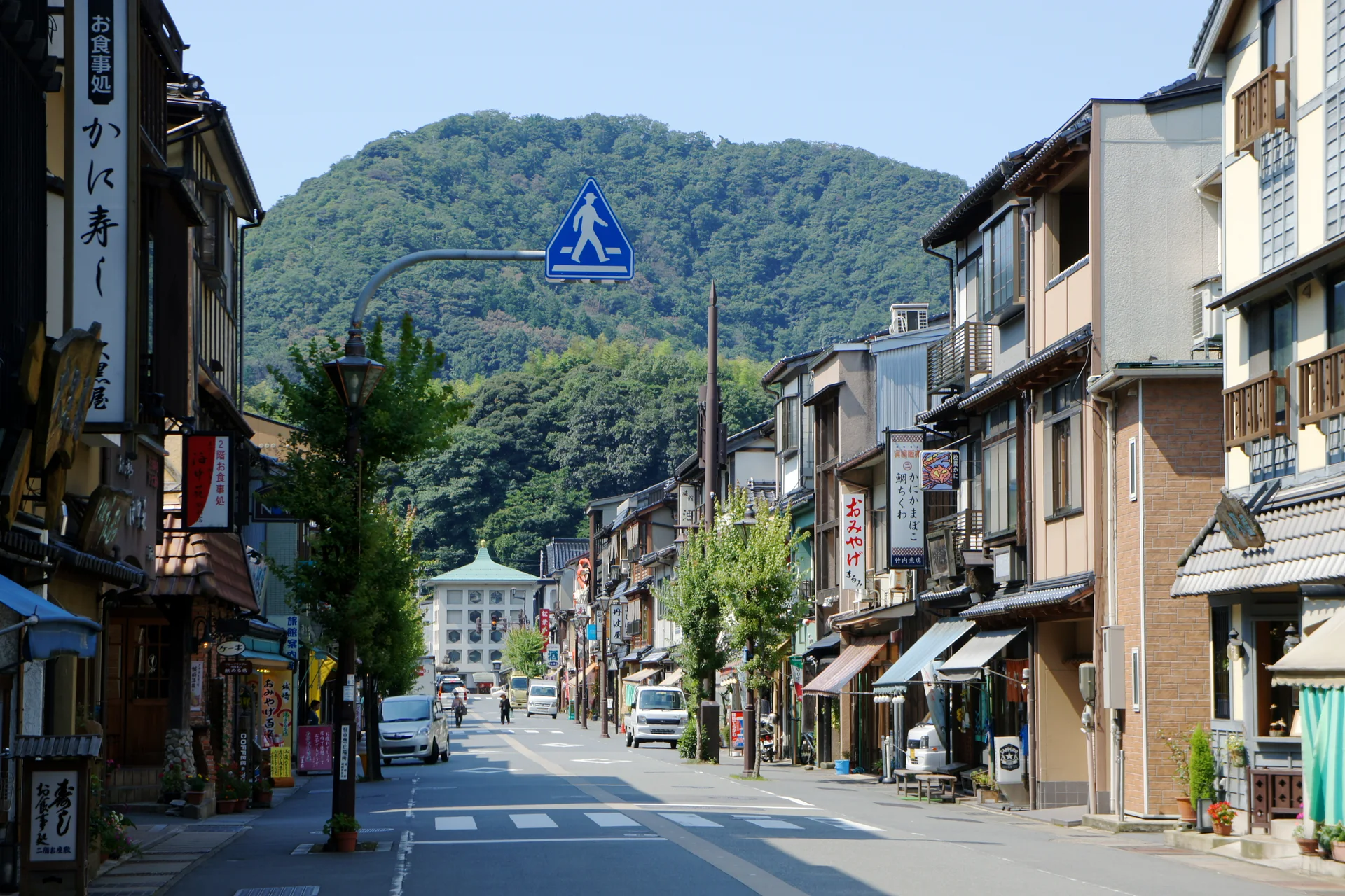 Kinosaki Onsen station street where travellers can hand luggage to local ryokan services instead of carrying it through town