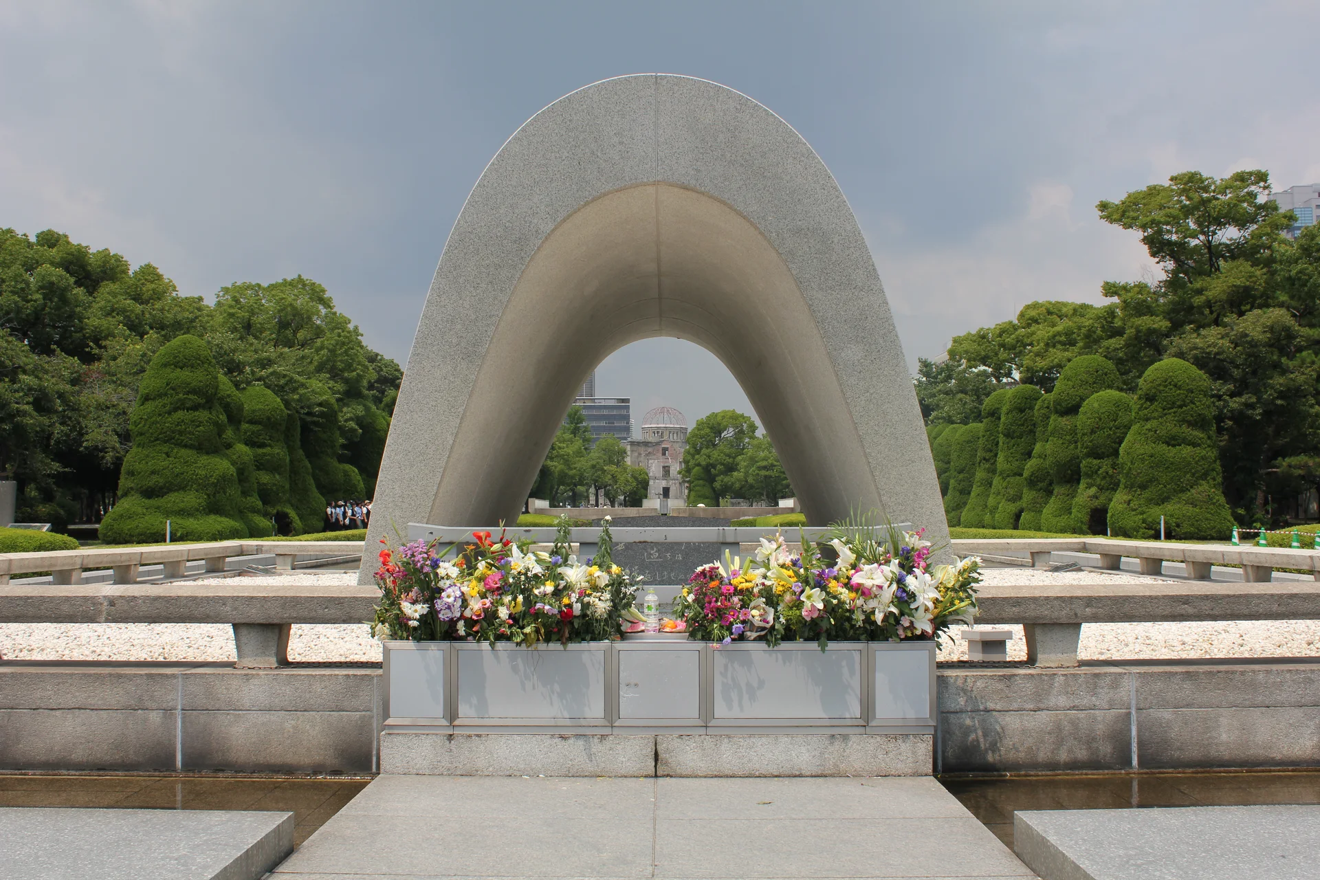 Hiroshima Peace Memorial Park cenotaph with the Atomic Bomb Dome in the background