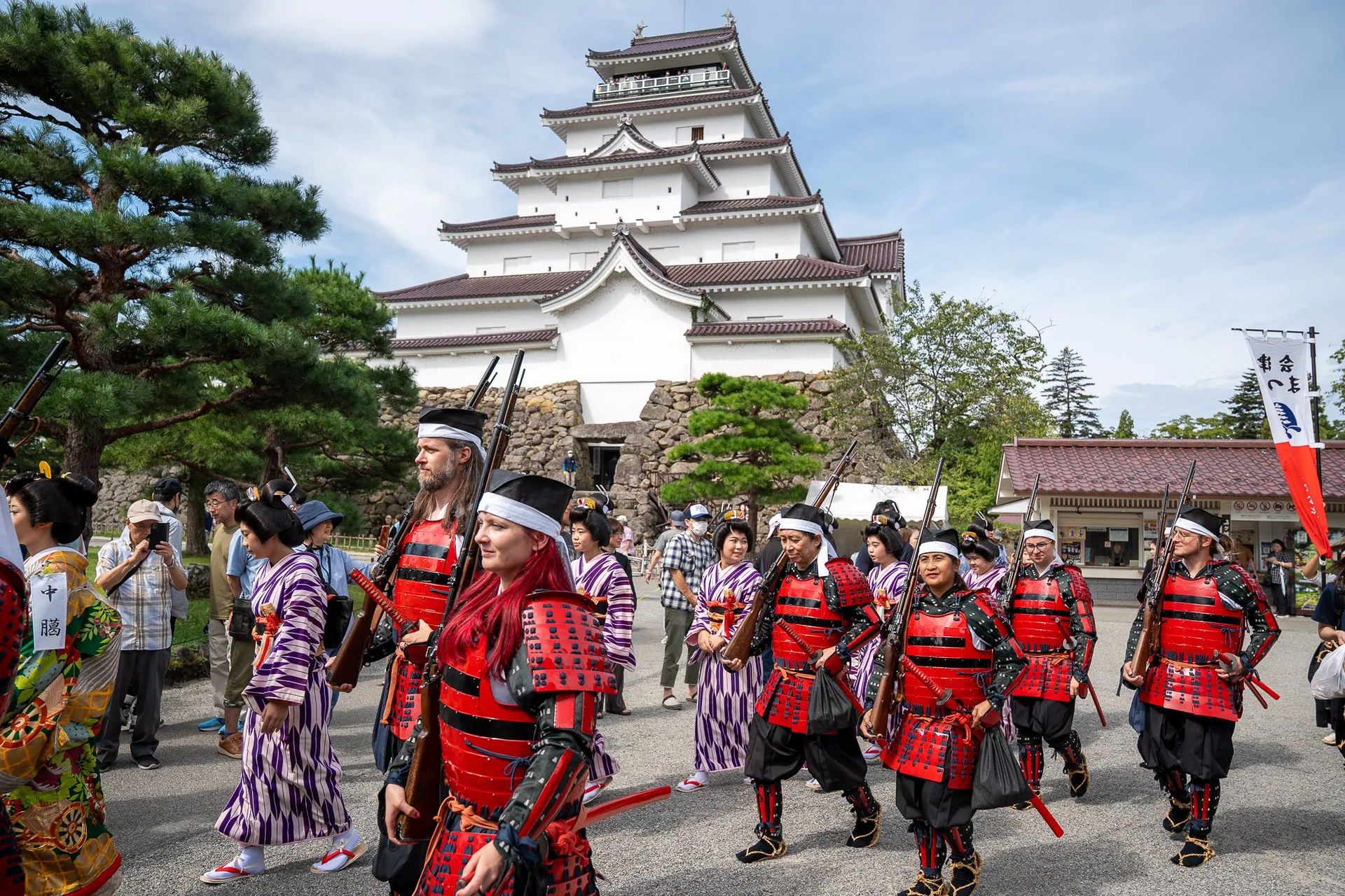 Aizu Festival participants in historical costume in front of Tsurugajo Castle