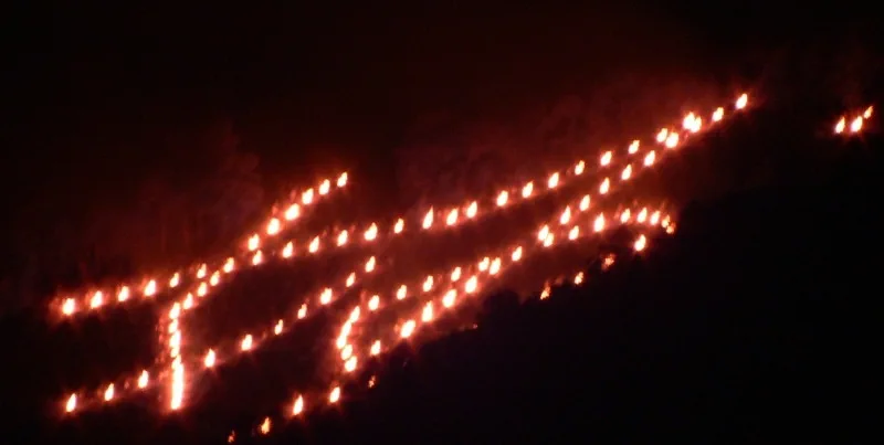 Myo bonfire glowing on the Kyoto hillside during Gozan Okuribi
