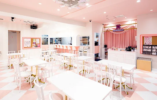 Maidreamin Fukuoka Tenjin seating and stage area: decide whether you want standard cafe time or the different HYPER night format before booking.
