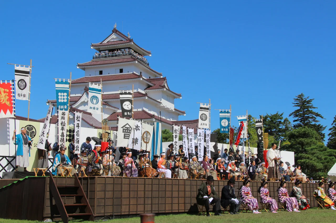 Aizu Festival stage and historical banners at Tsurugajo Castle in Aizuwakamatsu