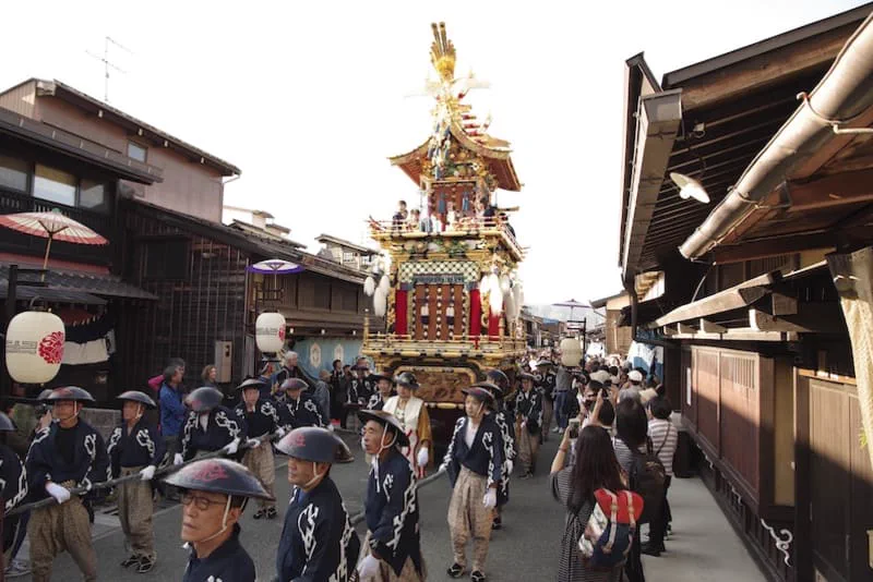 Ornate Takayama Autumn Festival float displayed in daylight near Sakurayama Hachimangu