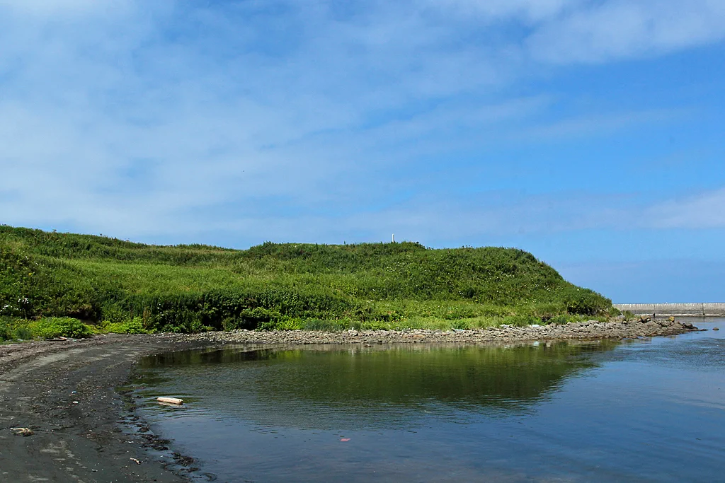 Onnemoto Ainu fortified enclosure site on a grassy coastal headland in Nemuro, Hokkaido