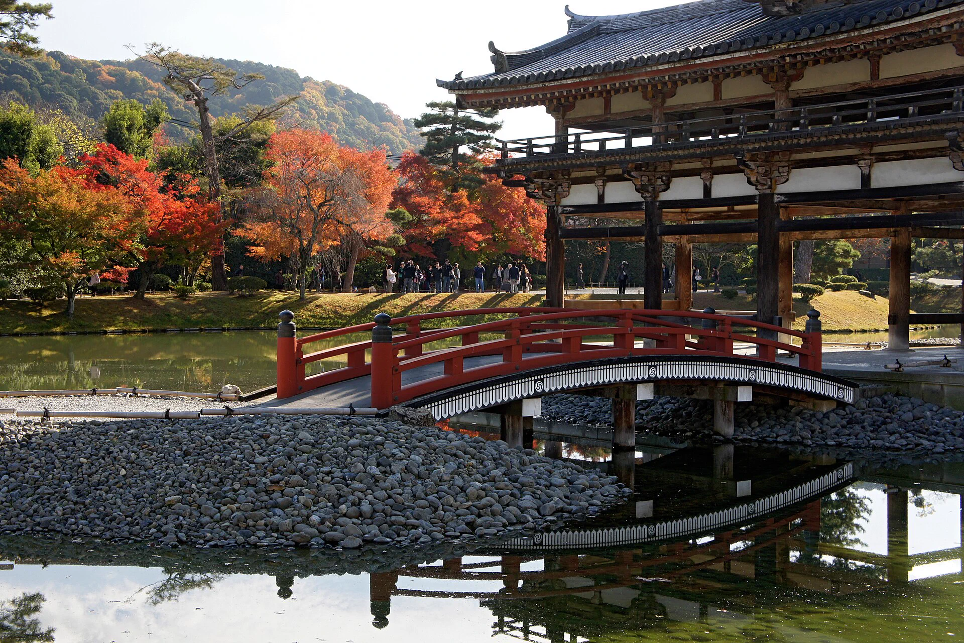 Byodoin Phoenix Hall and pond in Uji during autumn
