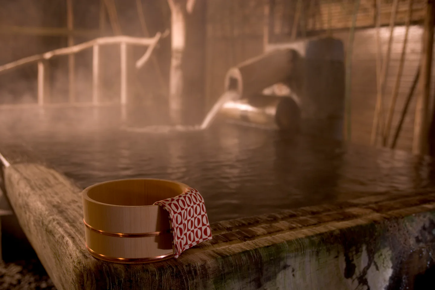 Japanese onsen etiquette guide covering washing, towels, tattoos and safe bathing