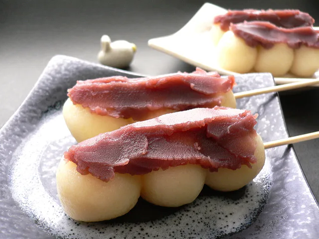 Traditional Japanese Tsukimi moon-viewing scene with seasonal food