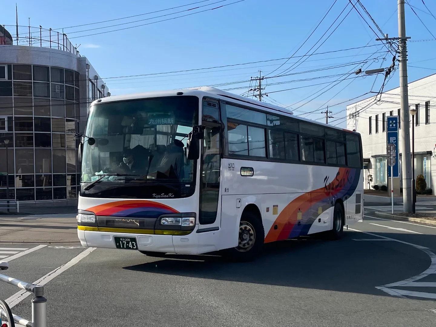 A Kyushu Sanko regional bus, where boarding doors and payment rules vary by route and operator