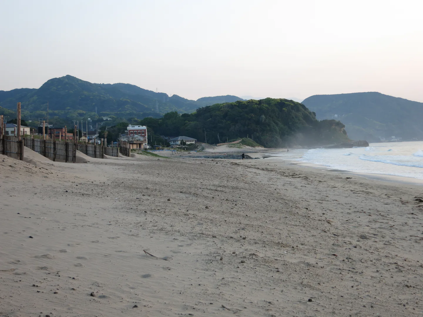 Shimoda beach at dawn for comparing an east-coast stay with Shuzenji Onsen